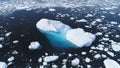 Aerial flight over iceberg among Antarctica ocean.