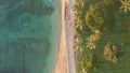 Aerial flight over a tropical beach. Cinematic video shooting. Aerial drone slowly flying over colorful landscape during