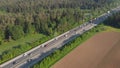 AERIAL: Flying above dense highway traffic slowly forming into a congestion. Royalty Free Stock Photo