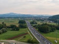 AERIAL: Flying above heavy highway traffic slowly moving towards capital city Royalty Free Stock Photo