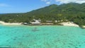 AERIAL: Flying along the picturesque sandy beaches and hotel on exotic island.