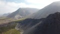 Aerial Flying Forward Toward Volcanic Mountain Ridgeline