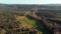 Aerial of flying over a beautiful green valley in a rural landscape. Andalusia, Spain