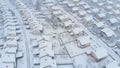 AERIAL: Flying over the empty private properties on a idyllic snowy winter day.