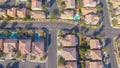 AERIAL: Flying over the rooftops of idyllic terraced houses in American suburbia