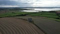Aerial footage of Burt Castle in Burt, County Donegal, Ireland, surrounded by green lands