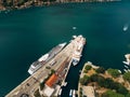 Aerial shot from the drone - two liners moored on the pier near the old town of Kotor, in the Gulf, Montenegro. Top view Royalty Free Stock Photo