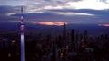 Aerial footage of KL Tower and KL CC in the background during the early sunrise with orange lights