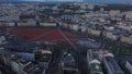 Aerial footage of large public square with skatepark. Plaine de Plainpalais surrounded with multistorey apartment