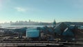 Aerial footage of the North Vancouver trainyard and cargo terminal with a view of Downtown Vancouver.