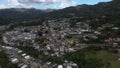 Aerial footage over the small mountainside town of Adjuntas on a cloudy day, Puerto Rico