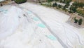 Aerial footage of Pamukkale travertines or Cotton Castle in Denzili, Turkey. Terraces of white limestone