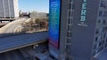 Aerial footage of Reverb by Hard Rock with skyscrapers and office buildings in the city skyline with a gorgeous clear blue sky