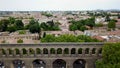Aerial footage of Saint-ClÃÂ©ment historical aqueduct and mediterranean city panorama