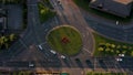 Aerial footage at sunset of traffic moving around a roundabout in Sheffield, South Yorkshire, UK