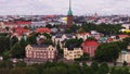 Aerial footage of townhouses and villas in urban borough. Tall tower of Mikael Agricola Church. Helsinki, Finland