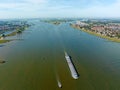 Aerial from a freighter cruising on the river Boven Merwede near Werkendam in the Netherlands