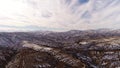 Aerial frlight of drone over the magnificent mountains covered with snow. Turke location. 4k. Cloudy blue sky.