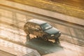 Aerial front side view rolling shot with Volkswagen Golf Mk3 car. Fast moving black old hatchback with motion blur effect on sunny Royalty Free Stock Photo