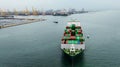 aerial front view cargo container ship carrying in sea import export goods and distributing products to dealer consumers, global Royalty Free Stock Photo