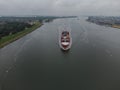 Aerial front view of containervessel sailing the port of Rotterdam