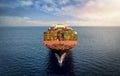 Aerial front view of a large, loaded container cargo vessel