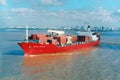 Aerial front view of a loaded container cargo vessel traveling over calm rio de la plata,buenos aires argentina,maqueira