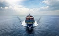 Aerial front view of a loaded container cargo vessel