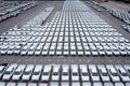 Aerial front view new cars lined up parked in a row in warehouse at the commercail dock for exporting to distributors and dealers