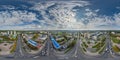 aerial full seamless spherical hdri 360 panorama view above road junction with traffic in city overlooking of residential area of