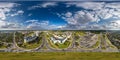 aerial full seamless spherical hdri 360 panorama view above road junction with traffic in city overlooking of residential area of