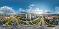 aerial full seamless spherical hdri 360 panorama view above road junction with traffic in city overlooking of residential area of