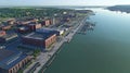 Aerial GIS visualization of an urban riverfront featuring LiDAR data of elevation docks and infrastructure.
