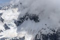 Cloud wisps and snow landslides at Selwyn glacier, New Zealand