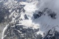 Snow landslides and cloud wisps at Selwyn glacier, New Zealand