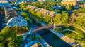 Aerial Golden Hour Canal with Red Bridge and Townhouses Royalty Free Stock Photo