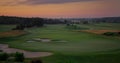 Aerial golf park sunset at cloud sky nature landscape. Golfing field background. Royalty Free Stock Photo