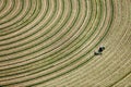 An aerial view of alfalfa hay being harvested.