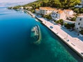 Sunken ship offshore Aerial - High ange view of village. Small Adriatic town