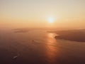 Aerial high angle drone sunset view of the Sydney Harbour area, Australia, seen from Manly suburb. Air is full of haze and smoke. Royalty Free Stock Photo