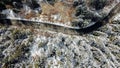 Aerial high angle view of narrow winding curvy mountain road. Royalty Free Stock Photo