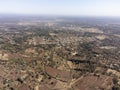 Aerial high angle view of town and arid, dry farmland near Nairobi, Kenya