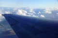 Aerial high in the sky shot of window view of plane leaving Honolulu Royalty Free Stock Photo