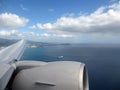 Aerial high in the sky shot of window view of plane leaving Honolulu Royalty Free Stock Photo