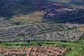 Aerial of Highway, Kapolei homes, golf course, and quarry on Oa Royalty Free Stock Photo