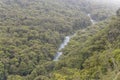 Aerial of Hollyford river in valley with rainforest lush vegetation, near Pop`s view, Fiordland Park, New Zealand