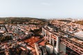 Aerial horizontal photo of streets and buildings of Lisbon on sunset. The Bridge of 25 april in Libson Royalty Free Stock Photo