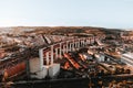 Aerial horizontal photo of streets and buildings of Lisbon on sunset. The Bridge of 25 april in Libson Royalty Free Stock Photo