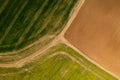 Aerial image of agricultural field with different cultures and colors.