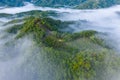 Aerial image of beautiful fresh green nature landscape scene of tropical rainforest and clouds during morning sunrise Royalty Free Stock Photo